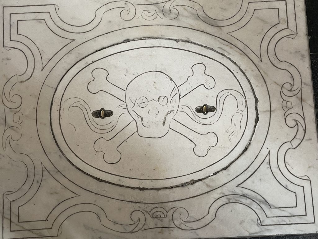 Skull and crossbones in the floor of Santa Croce basilica, Florence
