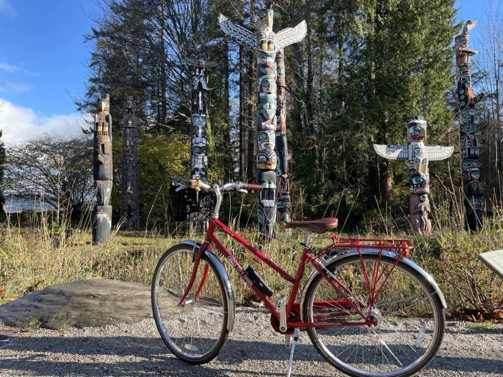 Bike with totem poles in Stanley Park Vancouver