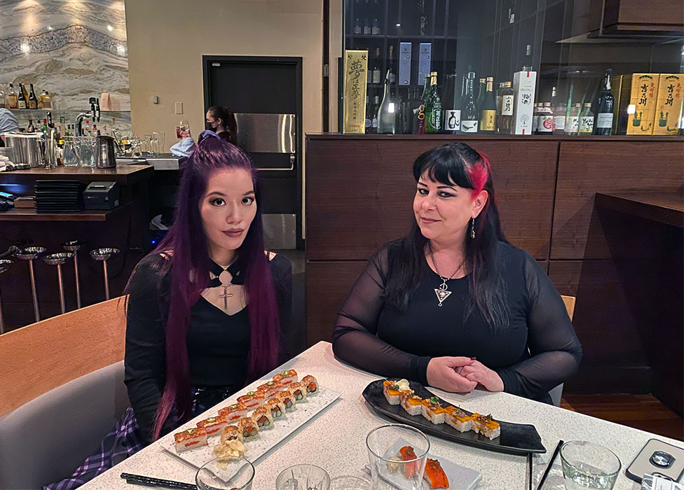 La Carmina and Liisa in a sushi restaurant in Vancouver
